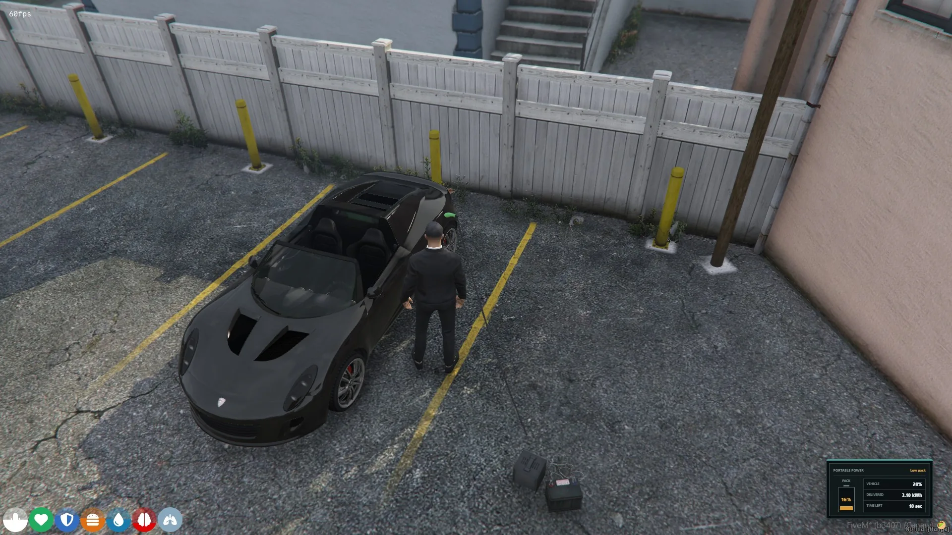 Portable EV pack charging a black convertible with 16 percent pack charge and 28 percent vehicle charge.